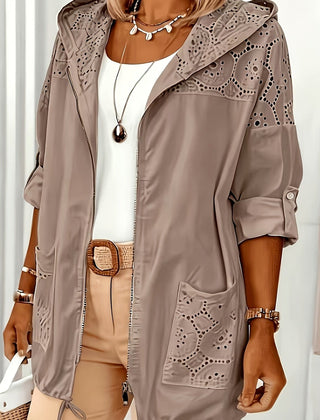 Women’s Iris hooded jacket by Christine Brewer, featuring a stylish, lightweight design with a hood and zipper closure.