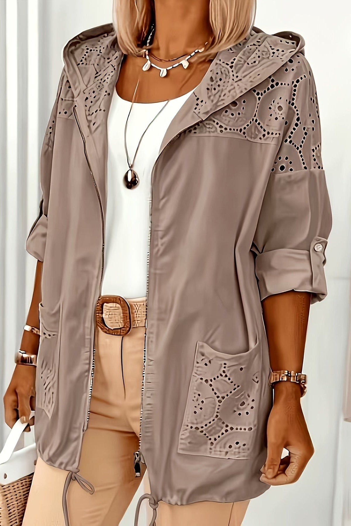 Women’s Iris hooded jacket by Christine Brewer, featuring a stylish, lightweight design with a hood and zipper closure.