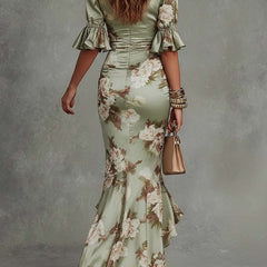 V-neck maxi dress for women by Christine Brewer, flowing fabric, sleeveless design, and elegant silhouette.