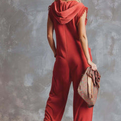 Raspberry red cotton hooded zip-front jumpsuit for women with long sleeves and pockets, by Christine Brewer.