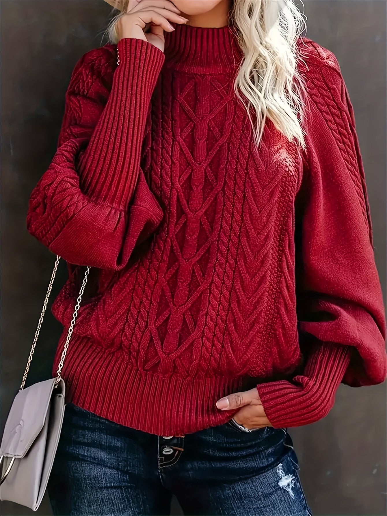 Women’s knit sweater by Christine Brewer featuring a cozy fit and ribbed cuffs in a neutral color.