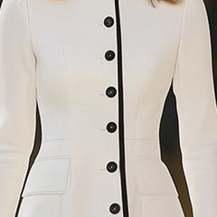 Women’s dress by Christine Brewer featuring a stylish, flowy design with a fitted waist and elegant neckline.