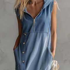 Blue denim V-neck midi dress by Christine Brewer, casual dress with sleeveless design and fitted waist, shown on a model.