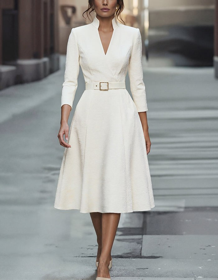 Gold V-neck A-line midi dress with three-quarter sleeves for women by Christine Brewer, shown on a model.