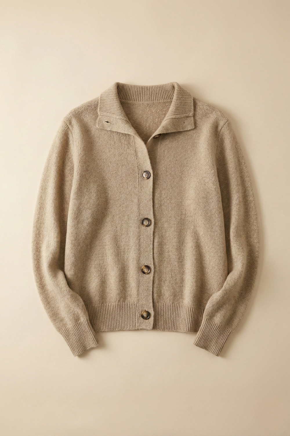 Christina cashmere high neck cardigan for women by Christine Brewer, soft beige knit with long sleeves and button closure.