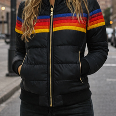 Women’s hooded quilted puffer jacket by Christine Brewer, featuring a stylish quilted design and warm hood for cold weather.