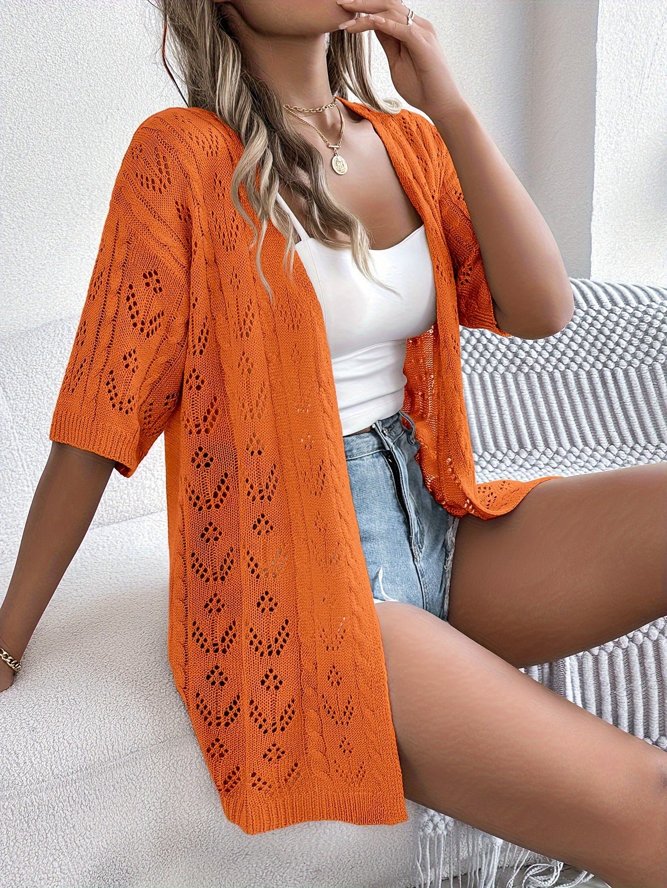 Emma knit cardigan for women by Christine Brewer, featuring a cozy, stylish top with a button-up design and ribbed cuffs.