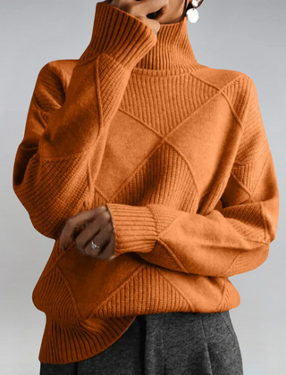 Women’s Margot turtleneck sweater by Christine Brewer, featuring a cozy knit design in a stylish, fitted silhouette.