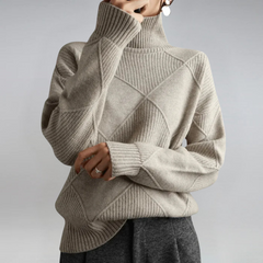 Christine Brewer Bella tailored versatile turtleneck sweater in soft fabric, shown in a neutral color with a fitted design.