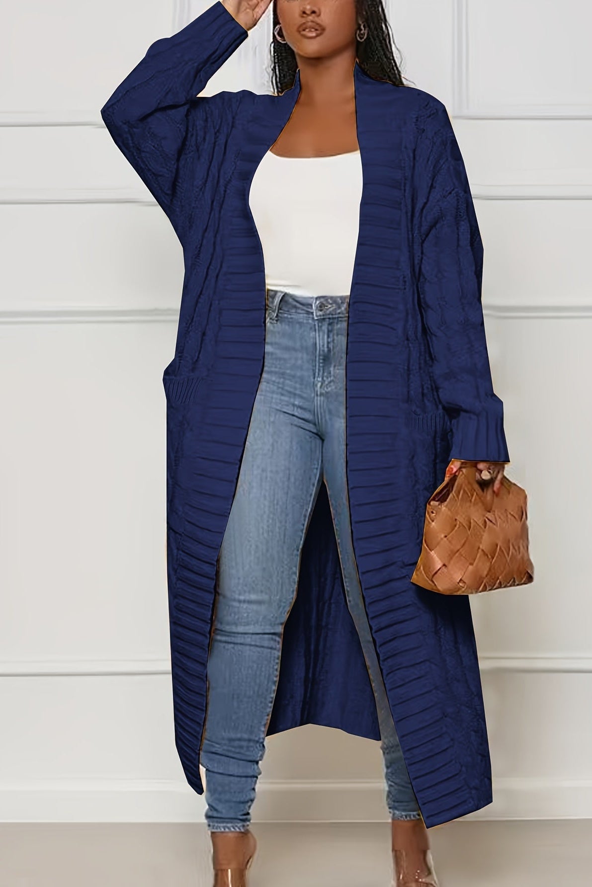 Sadie asymmetric knit cardigan for women by Christine Brewer, featuring a stylish, cozy coat with a unique uneven hem detail.