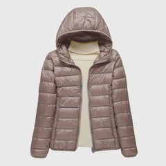Christine Brewer Lily ultra-light quilted jacket in soft fabric, showcasing a sleek, stylish design with a stand collar and subtle quilting.