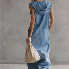 Blue denim V-neck midi dress by Christine Brewer featuring a casual style, with a fitted waist and knee-length hem.