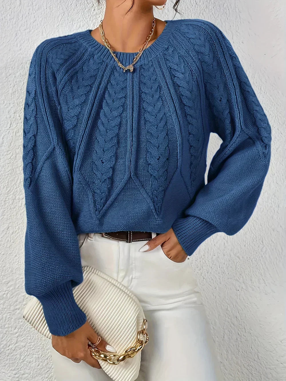 Pink knit sweater for women by Christine Brewer, featuring a cozy, textured design with a round neckline and long sleeves.
