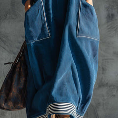 Blue corduroy midi dress by Christine Brewer, casual dress with long sleeves and fitted waist, displayed on a hanger.