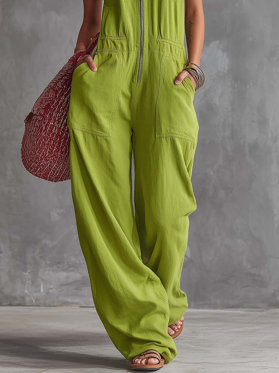 Bright green cotton linen zip-front jumpsuit for women, stylish and comfortable, by Christine Brewer, shown on a hanger.