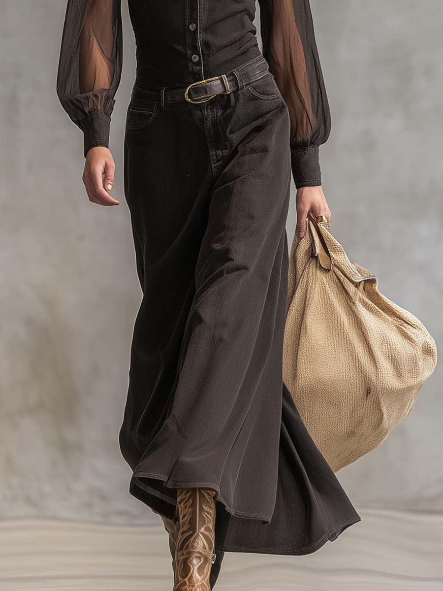 Black denim V-neck maxi dress by Christine Brewer, casual style, flowing length, sleeveless design, and fitted waist.