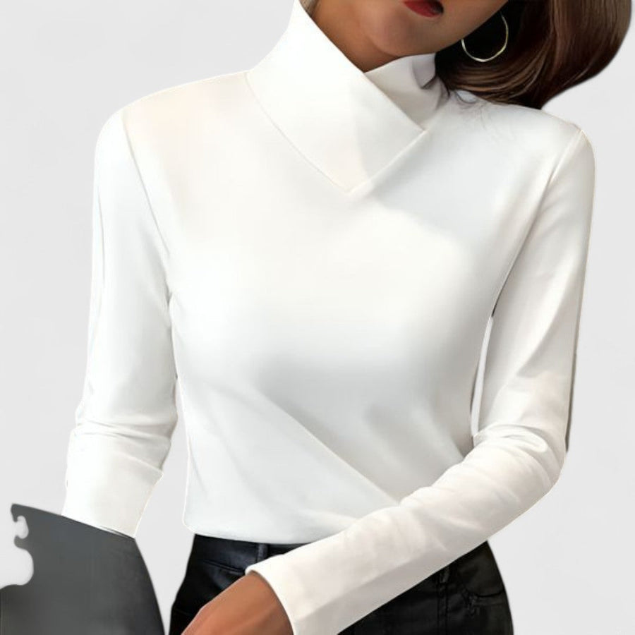Charlotte Versatile Chic Turtleneck Sweater by Christine Brewer, shown in a stylish, close-up view of the cozy, fitted black turtleneck.