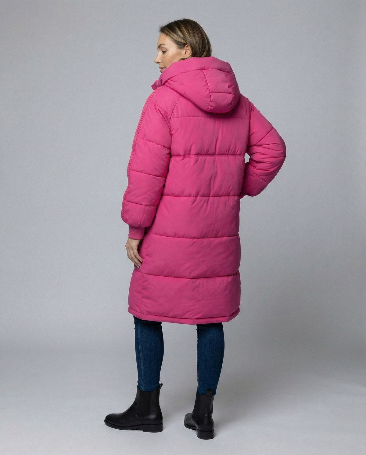 Back view of Anne Johansen oversized rose puffer jacket for women by Christine Brewer, showcasing its stylish quilted design.