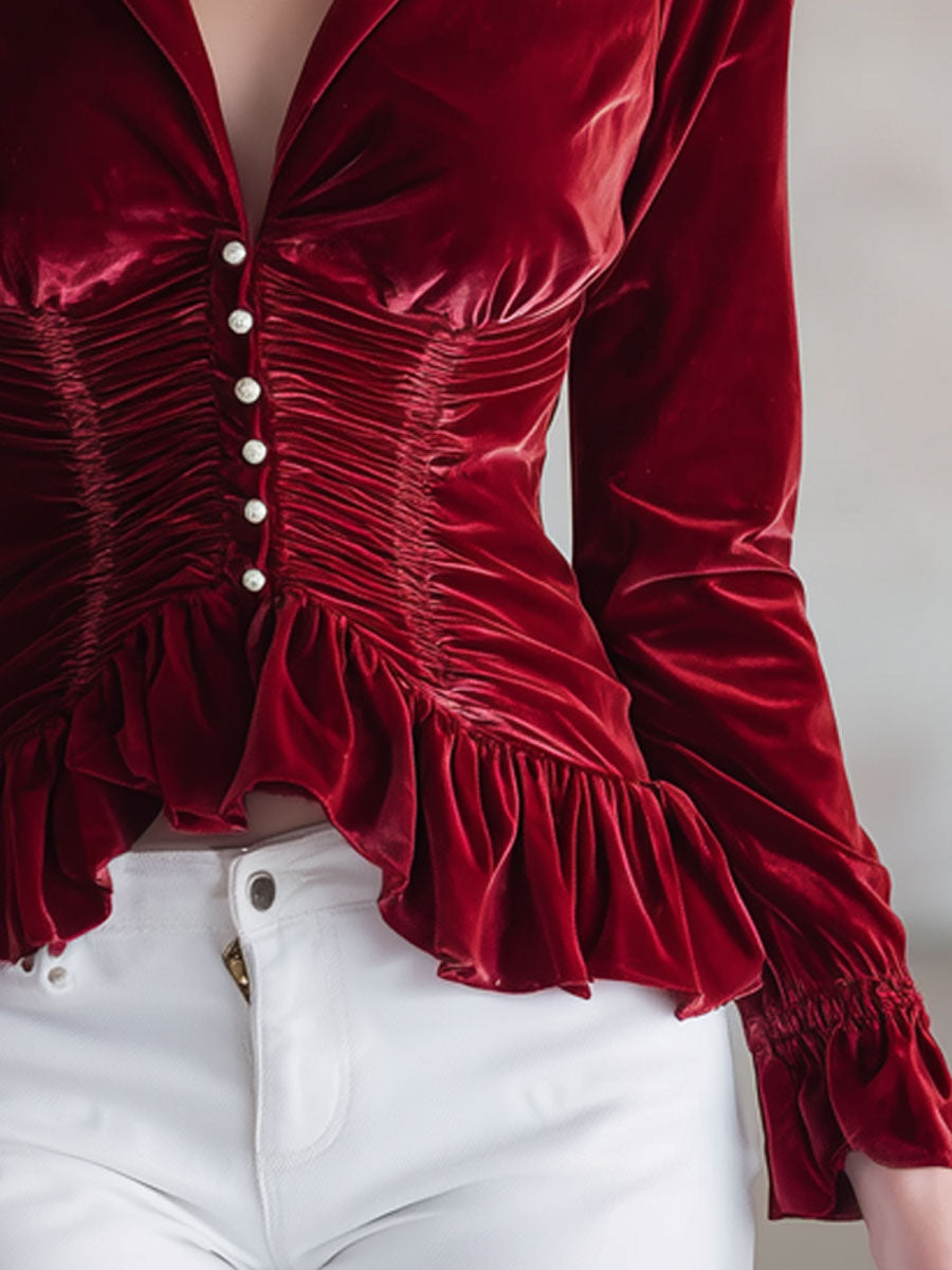 Red velvet pleated ruffled long sleeve blouse by Christine Brewer, featuring elegant design and detailed ruffle accents.