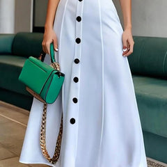 White maxi dress with puff sleeves, belted waist, and button details by Christine Brewer, featuring a lapel collar and solid color design.