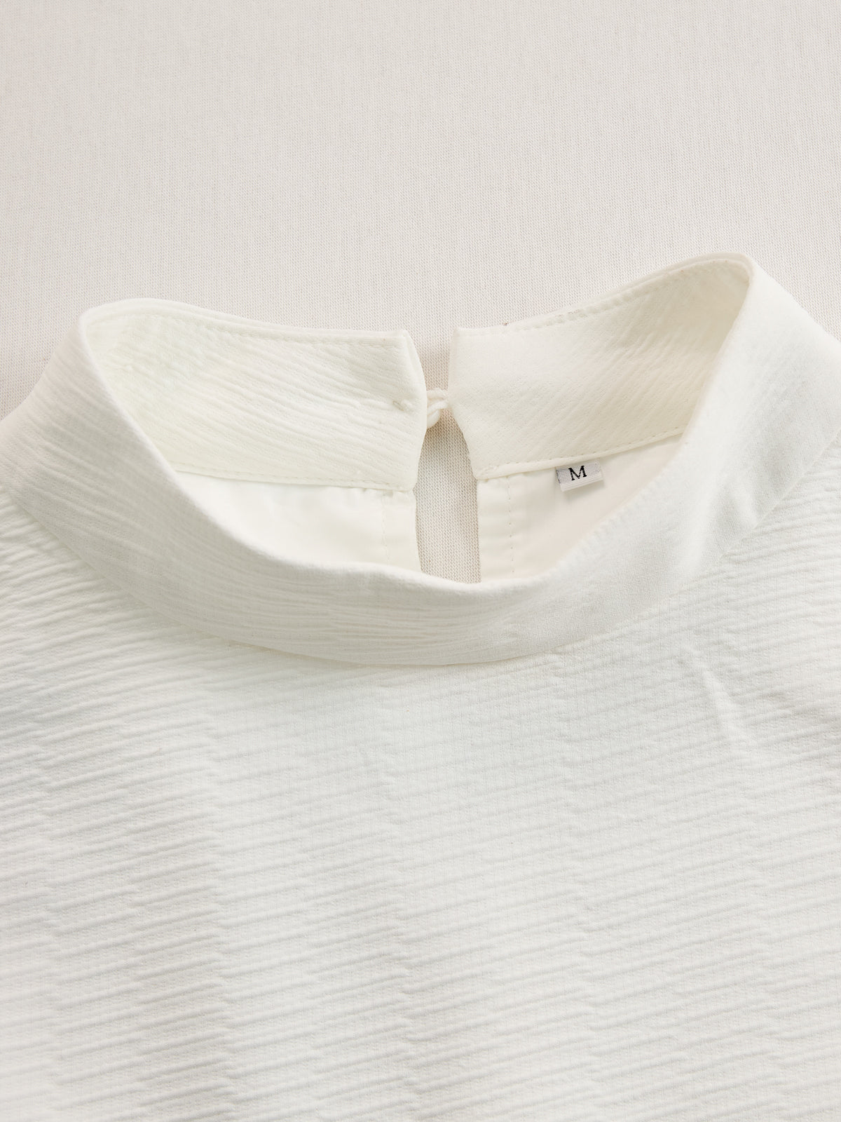Cream textured lantern sleeve two-piece set for women featuring stylish pants by Christine Brewer, shown in the product image.