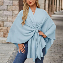 Christine Brewer Cecilia knit poncho for women, stylish and cozy top in soft fabric, draped over a model's shoulders.