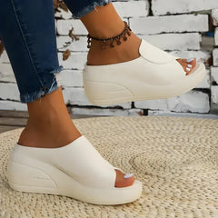 Comfortable Christine Brewer Eliza orthopedic slip-on wedge sandals for women with supportive design and casual style.