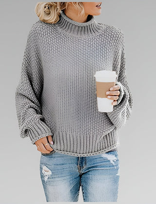 Amy Winifred ribbed orange sweater for women by Christine Brewer, featuring a close-up of the textured knit fabric.