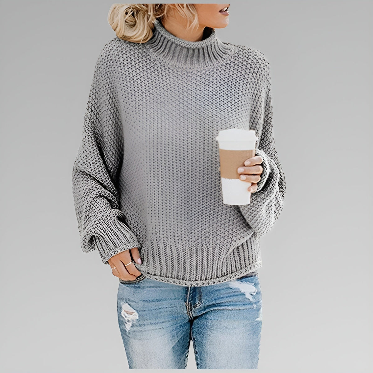 Amy Winifred ribbed orange sweater for women by Christine Brewer, featuring a close-up of the textured knit fabric.