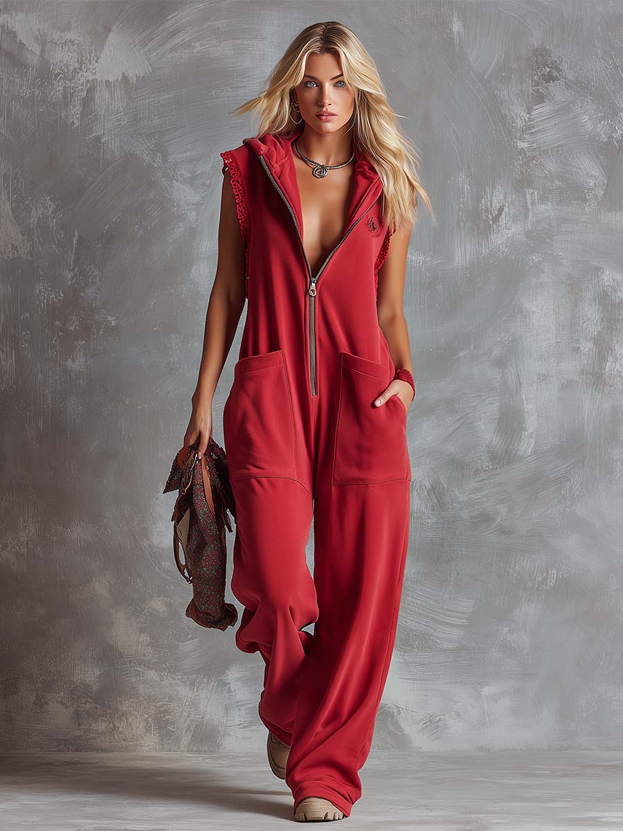 Raspberry red cotton hooded zip-front jumpsuit for women, featuring long sleeves and a relaxed fit by Christine Brewer.