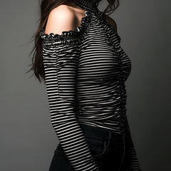 Black striped high neck cold-shoulder T-shirt with ruched details by Christine Brewer, featuring a fitted style and long sleeves.