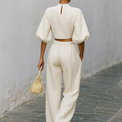 Cream textured lantern sleeve two-piece set for women featuring pants and a stylish top by Christine Brewer.