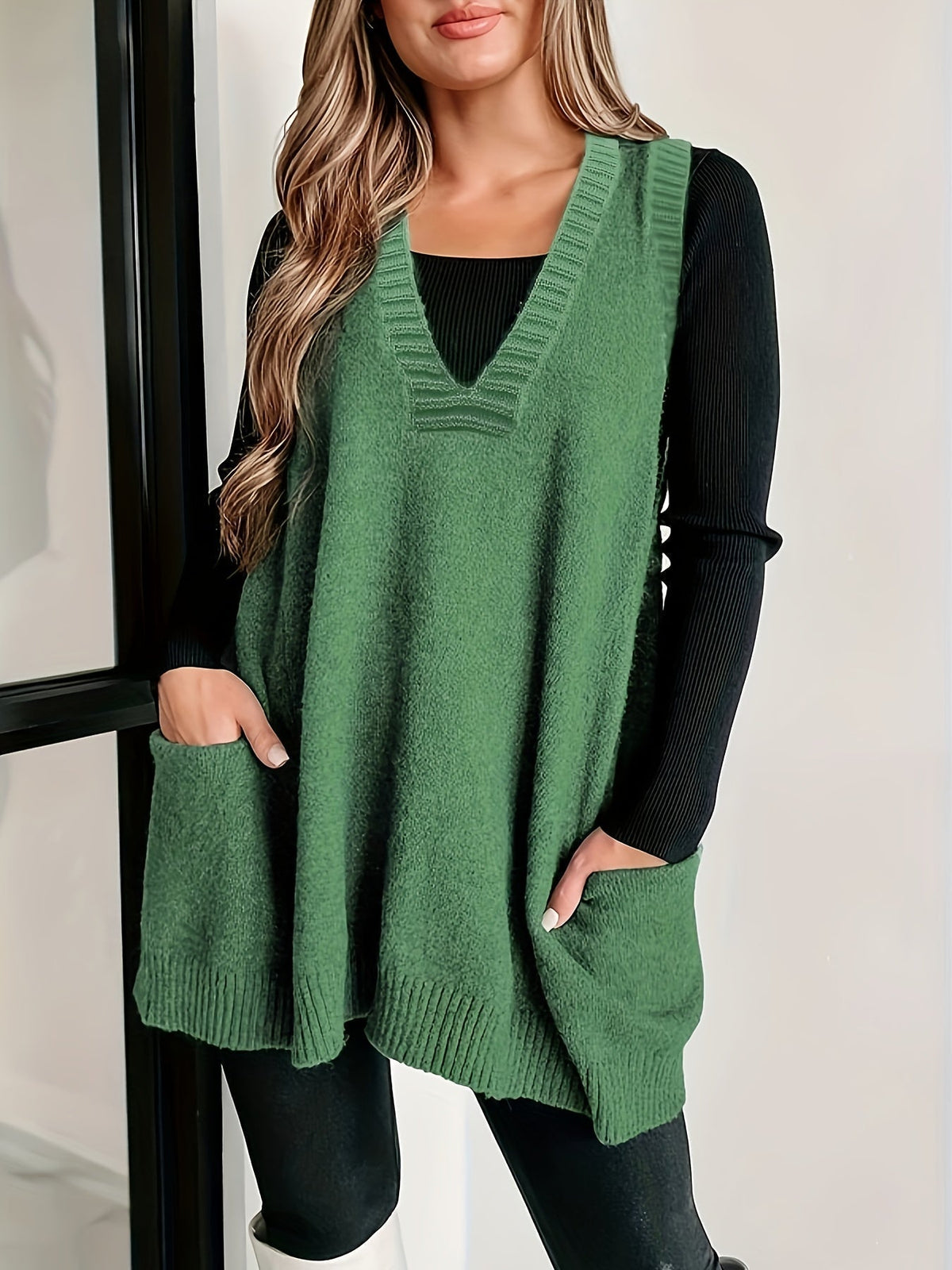 Kelly sleeveless knit sweater vest for women by Christine Brewer, featuring a V-neck design and a soft, textured fabric.