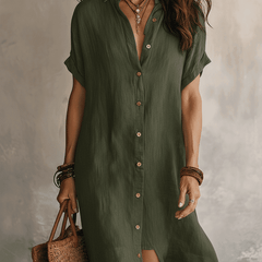Black linen relaxed midi dress for women by Christine Brewer, featuring a flowy silhouette and comfortable fit.