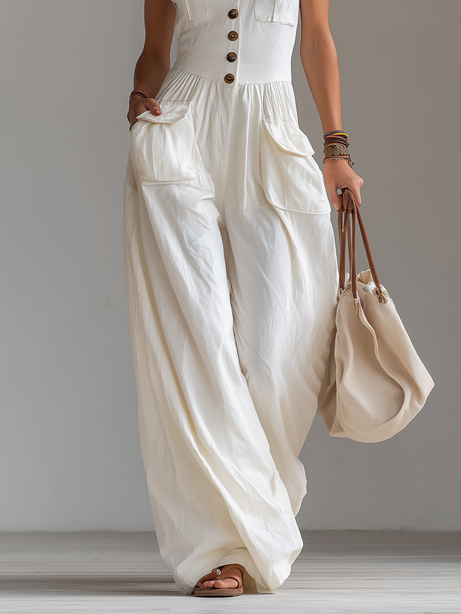White sleeveless wide-leg jumpsuit with patch pockets for women, by Christine Brewer, shown in a stylish, casual fit.