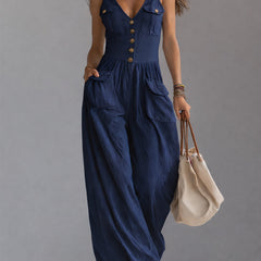 White sleeveless wide-leg jumpsuit with patch pockets for women by Christine Brewer, featuring a relaxed fit and stylish design.