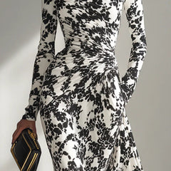 Black and white color-blocked printed long-sleeve maxi dress with pockets, slim fit, pleated design by Christine Brewer.