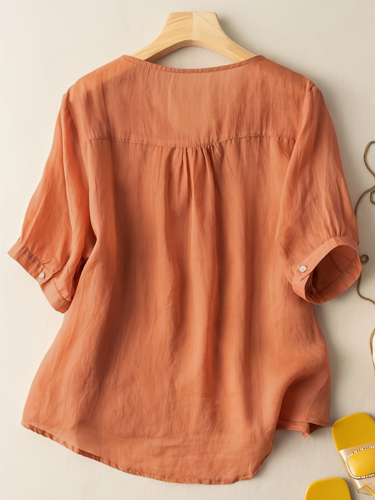 Light blue V-neck linen summer blouse for women, flowy and casual, by Christine Brewer, stylish top for warm weather.