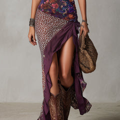 Leopard-print maxi dress for women by Christine Brewer, flowing fabric with a fitted bodice and long skirt, stylish and elegant.