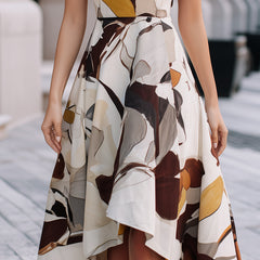 Abstract floral sleeveless fit and flare midi dress by Christine Brewer, featuring a vibrant pattern and flowing silhouette.