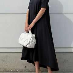 White high-low maxi dress with short sleeves from Christine Brewer, featuring a solid color and flowing fabric.