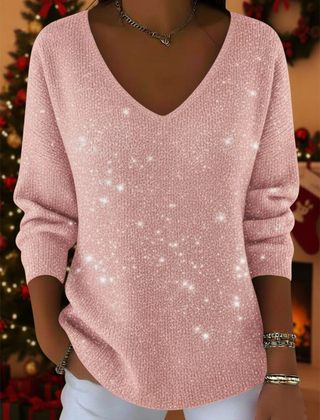 Christine Brewer Penelope soft knit Christmas sweater in elegant red with festive holiday patterns on a model.