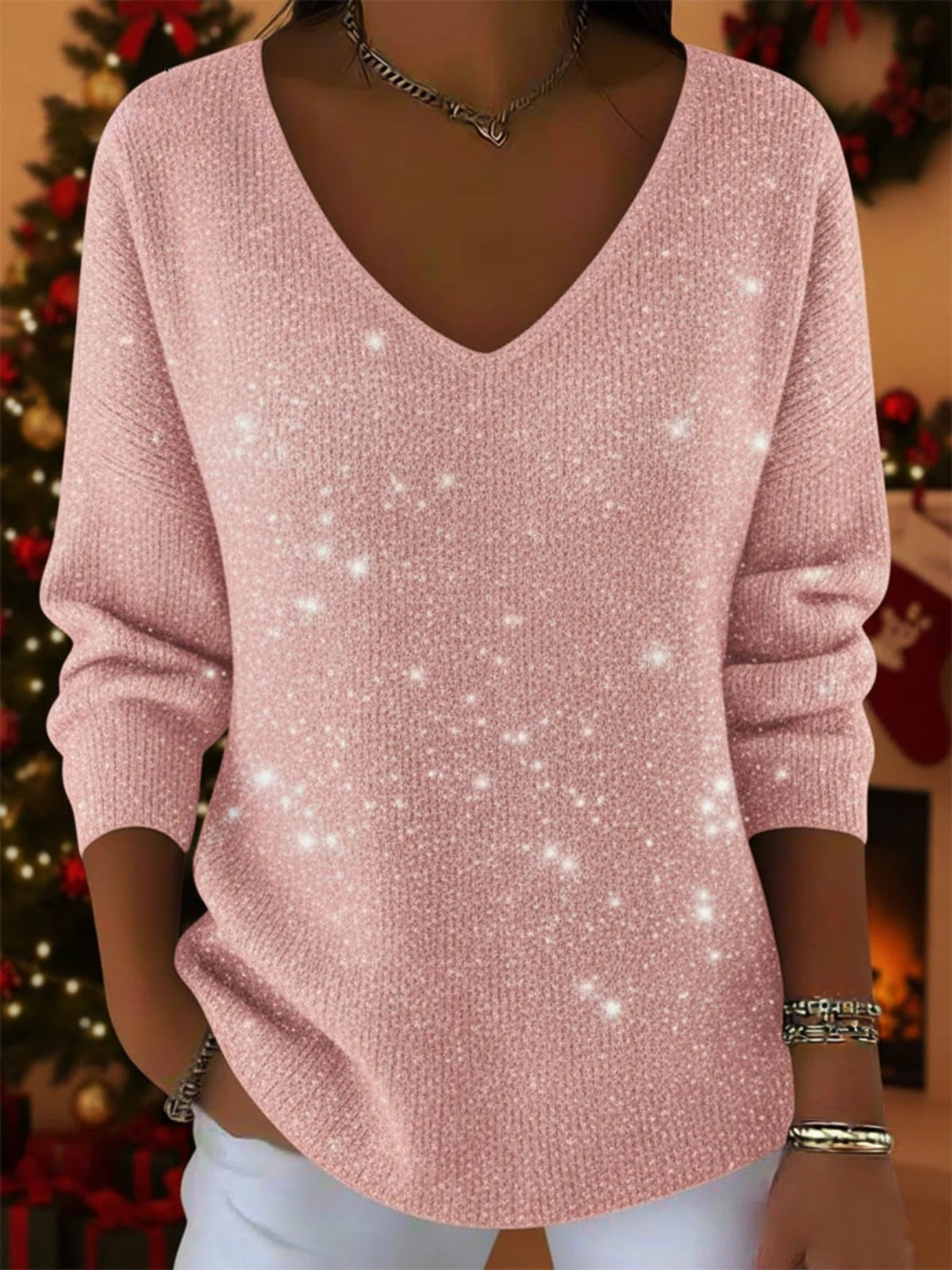 Christine Brewer Penelope soft knit Christmas sweater in elegant red with festive holiday patterns on a model.