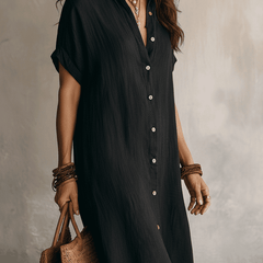 Black linen relaxed midi dress for women by Christine Brewer, featuring a flowy silhouette and casual, comfortable fit.