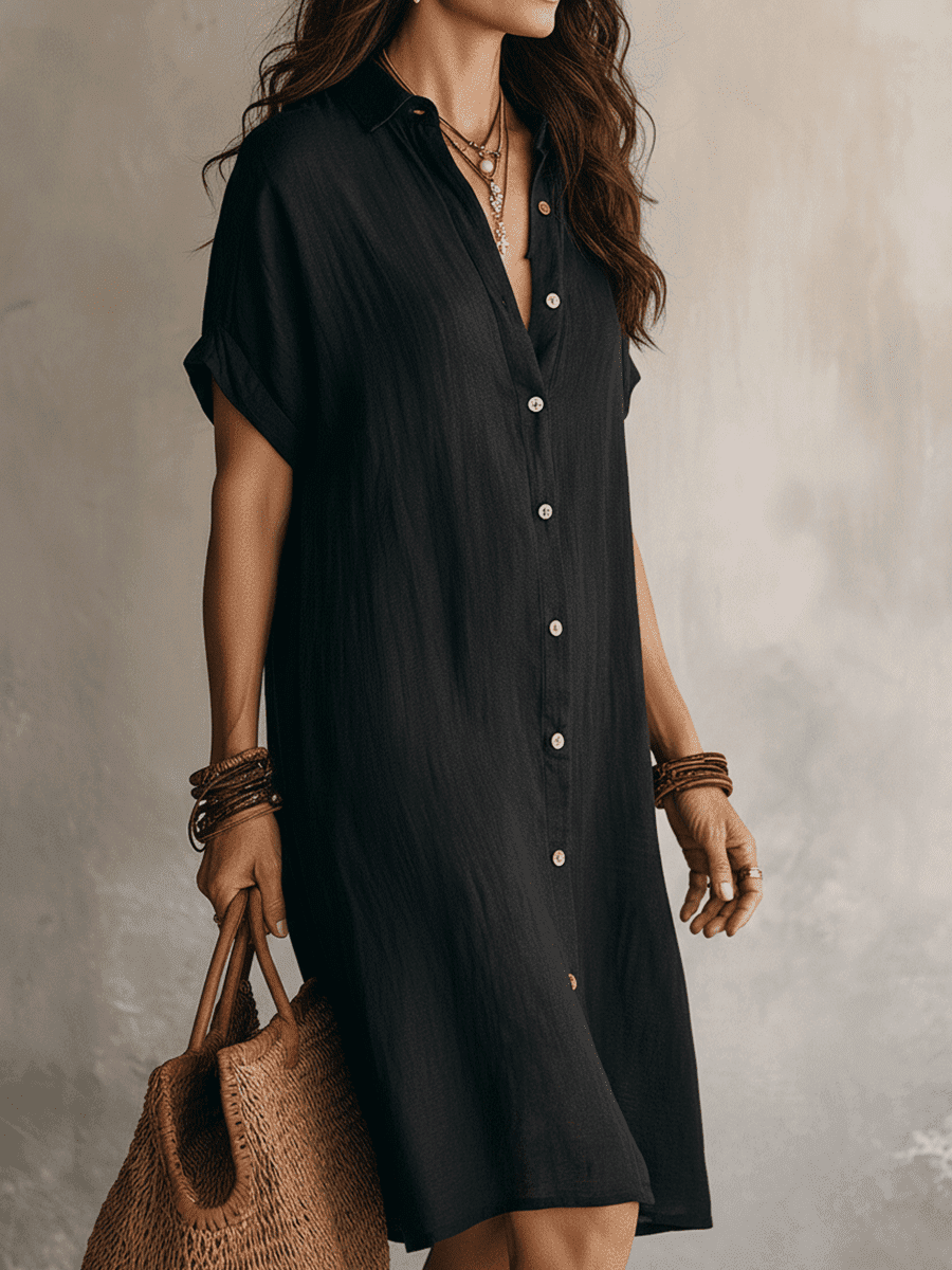 Black linen relaxed midi dress for women by Christine Brewer, featuring a flowy silhouette and casual, comfortable fit.