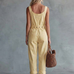 Light yellow denim jumpsuit for women featuring a square neckline and zip-front closure, styled as pants from Christine Brewer.