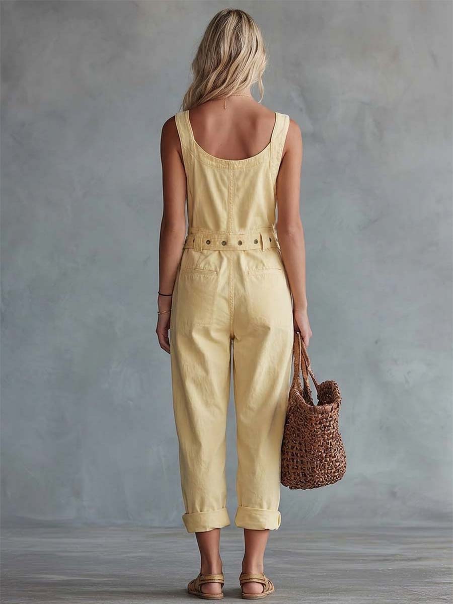Light yellow denim jumpsuit for women featuring a square neckline and zip-front closure, styled as pants from Christine Brewer.
