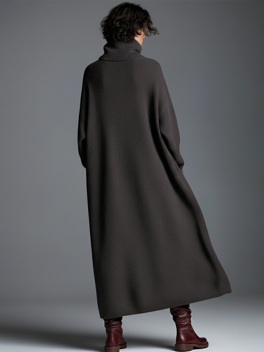 Brown knit maxi dress for women by Christine Brewer, featuring a flowing, long-sleeve design with a fitted waist and soft fabric.