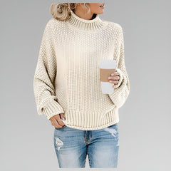 Amy Winifred ribbed orange women's sweater by Christine Brewer, showcasing the textured knit and fitted style.
