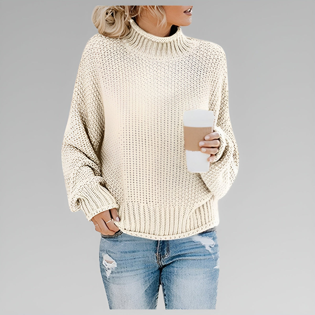 Amy Winifred ribbed orange women's sweater by Christine Brewer, showcasing the textured knit and fitted style.